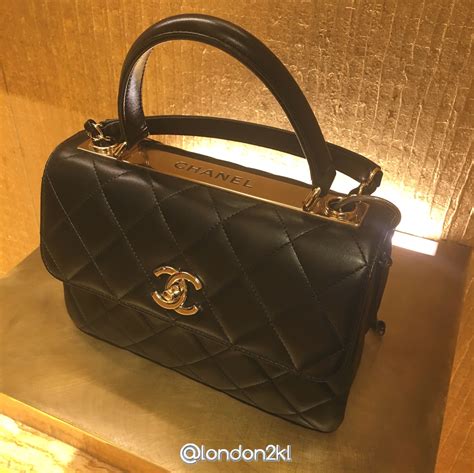 chanel top.handle|Chanel handbag with top handle.